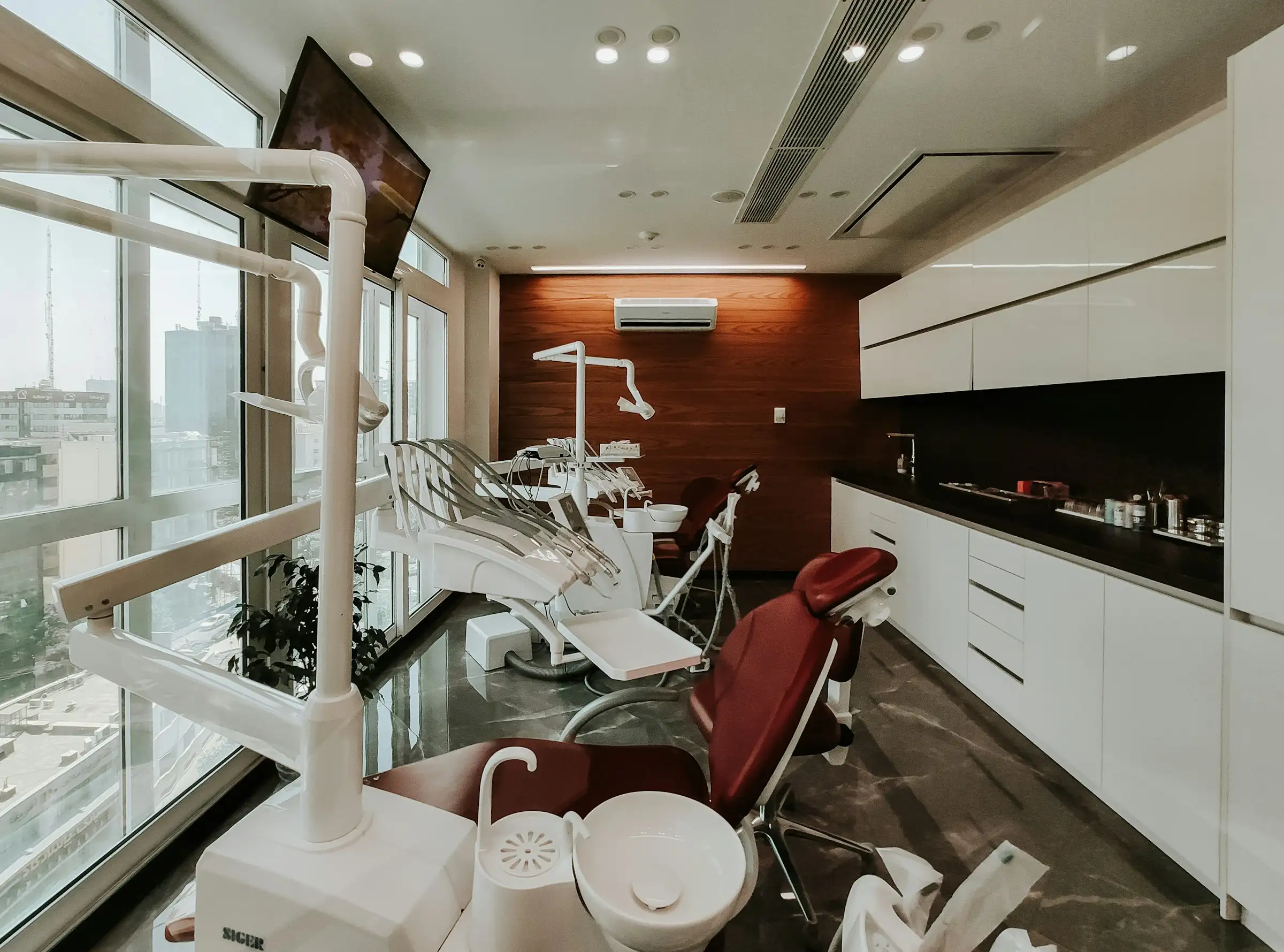 A dental operatory with the chair, delivery unit and cabinetry installed