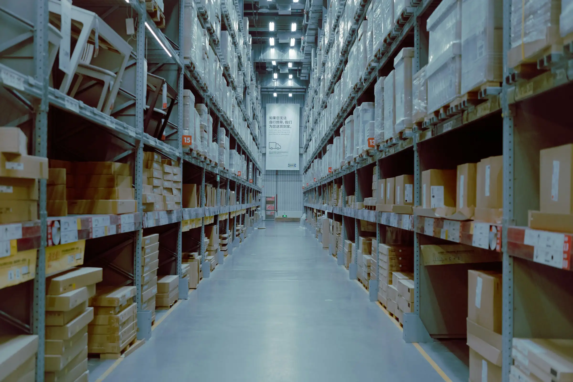 Warehouse shelving and racking installed along an aisle